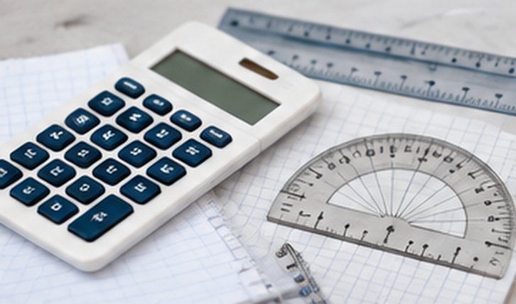 A calculator, a ruler and a protractor on squared paper